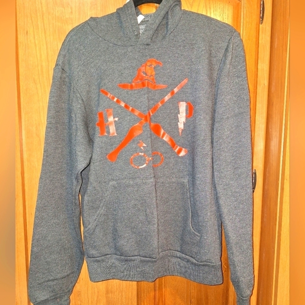 A Bella-Canvas Harry Potter Quidditch hoodie. Grey with red design.  Mens Large